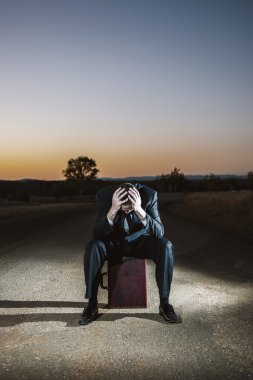 Frustrated businessman in the outback 